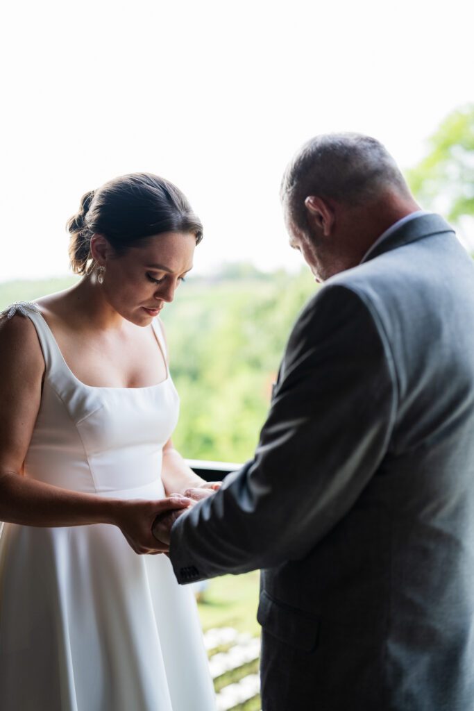 Terra Incognita Vineyard Wedding - Bride praying with her father